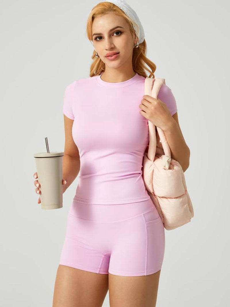 Women'S Two-Piece Athletic Set Consisting of a Solid Round-Neck T-Shirt and High-Waist Tight Sports Shorts. Yoga, Workouts at the Women'S Gym