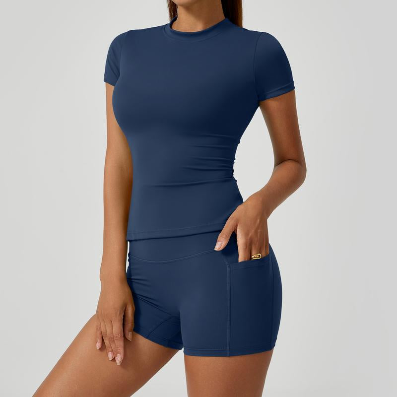 Women'S Two-Piece Athletic Set Consisting of a Solid Round-Neck T-Shirt and High-Waist Tight Sports Shorts. Yoga, Workouts at the Women'S Gym